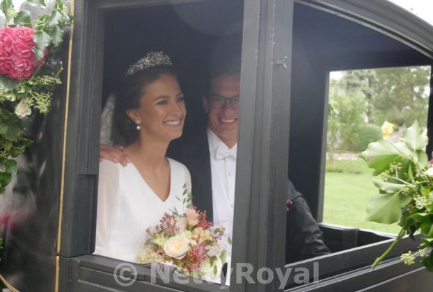 Rain can’t stop the bride smiling